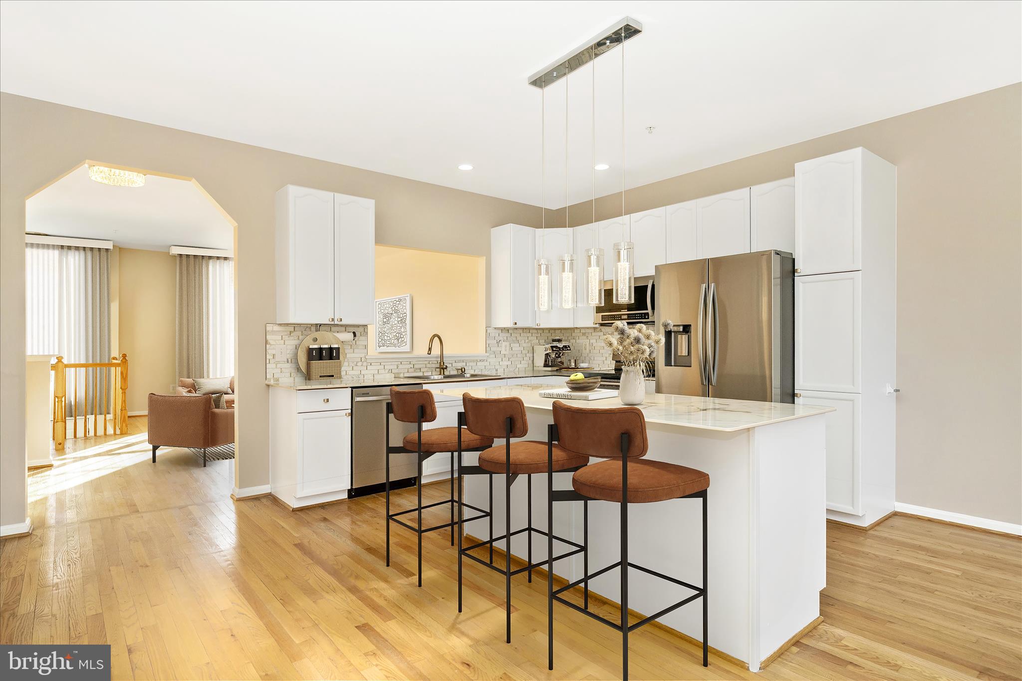 113 Fieldstone Court Frederick, MD 21702 - Photo 3 of 66 a kitchen with a refrigerator a stove top oven a sink dishwasher and white cabinets with wooden floor