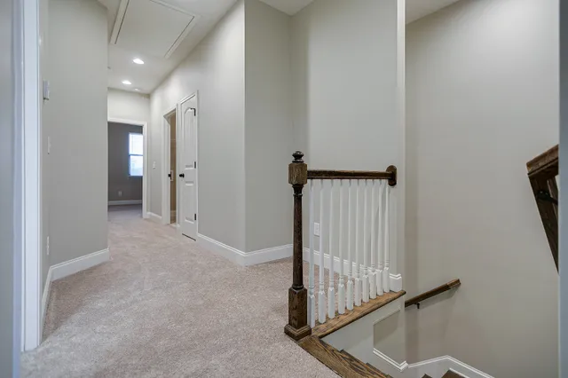 a view of a hallway with staircase