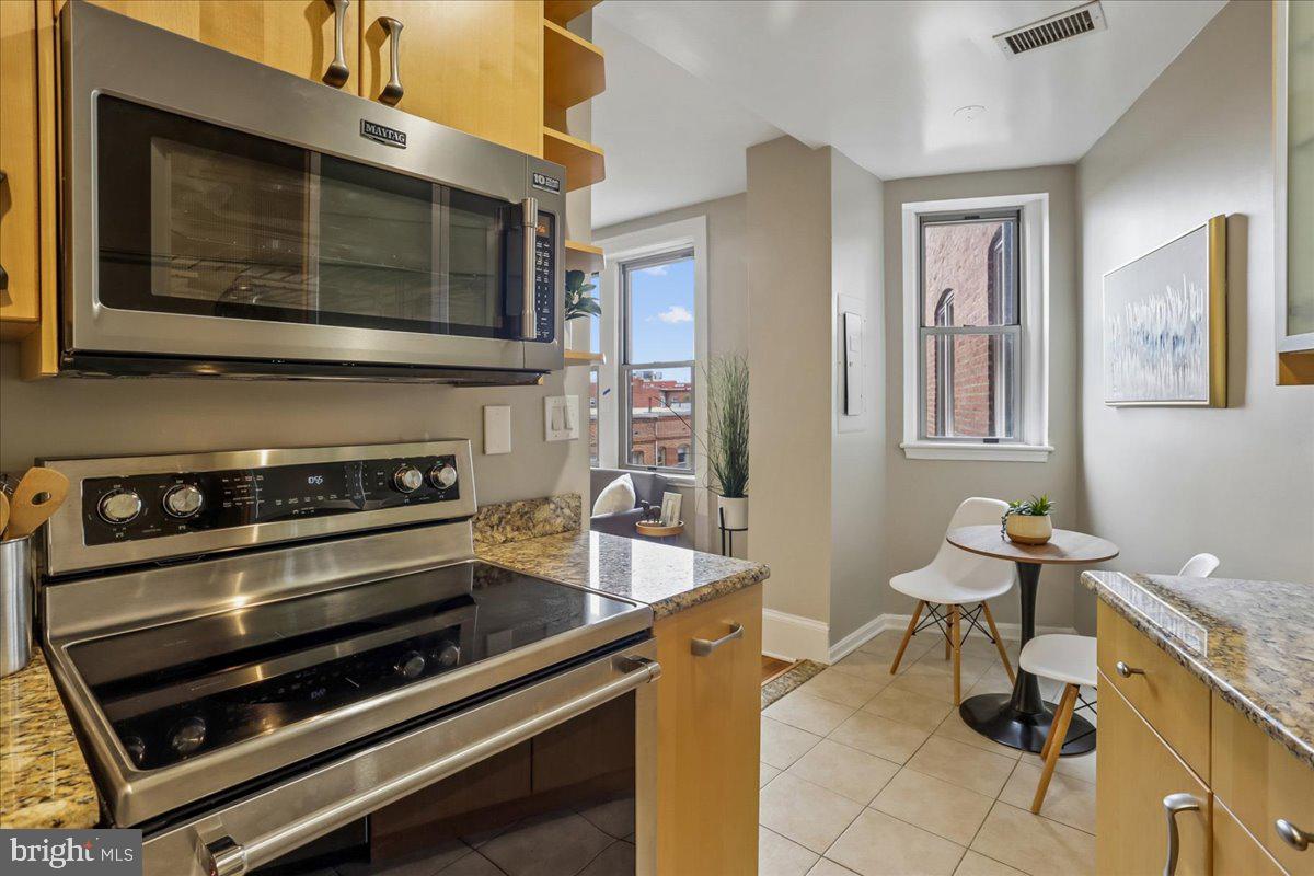 2129 Florida Avenue Northwest, Unit 407 Washington, DC 20008 - Photo 18 of 46 Bright kitchen with city views.