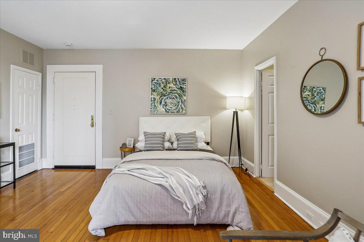 2129 Florida Avenue Northwest, Unit 407 Washington, DC 20008 - Photo 20 of 46 Serene bedroom with warm wood floors.