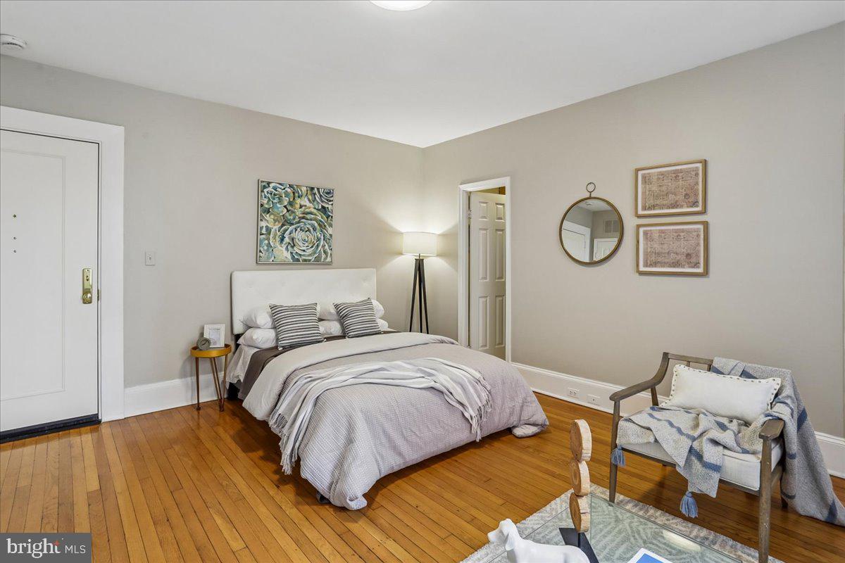 2129 Florida Avenue Northwest, Unit 407 Washington, DC 20008 - Photo 21 of 46 Serene bedroom with warm wood floors.