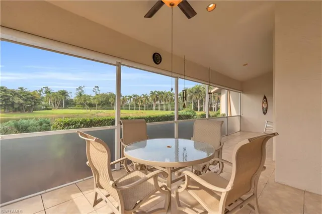 a view of a patio with a table chairs and a table