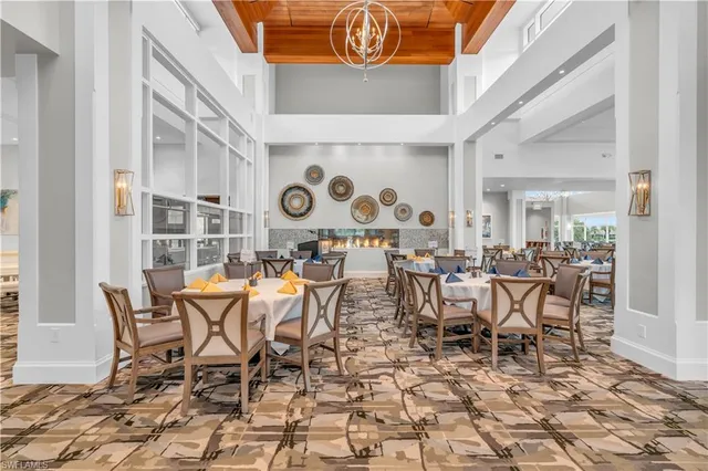 a kitchen with stainless steel appliances kitchen island granite countertop a refrigerator and a stove