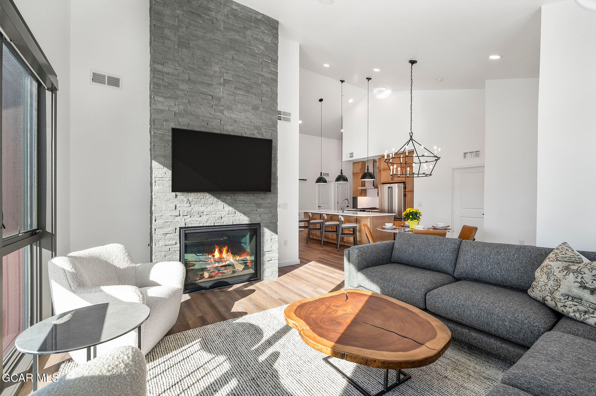 720 Baker Drive, Unit 410 Winter Park, CO 80482 - Photo 5 of 37 Great room view to kitchen