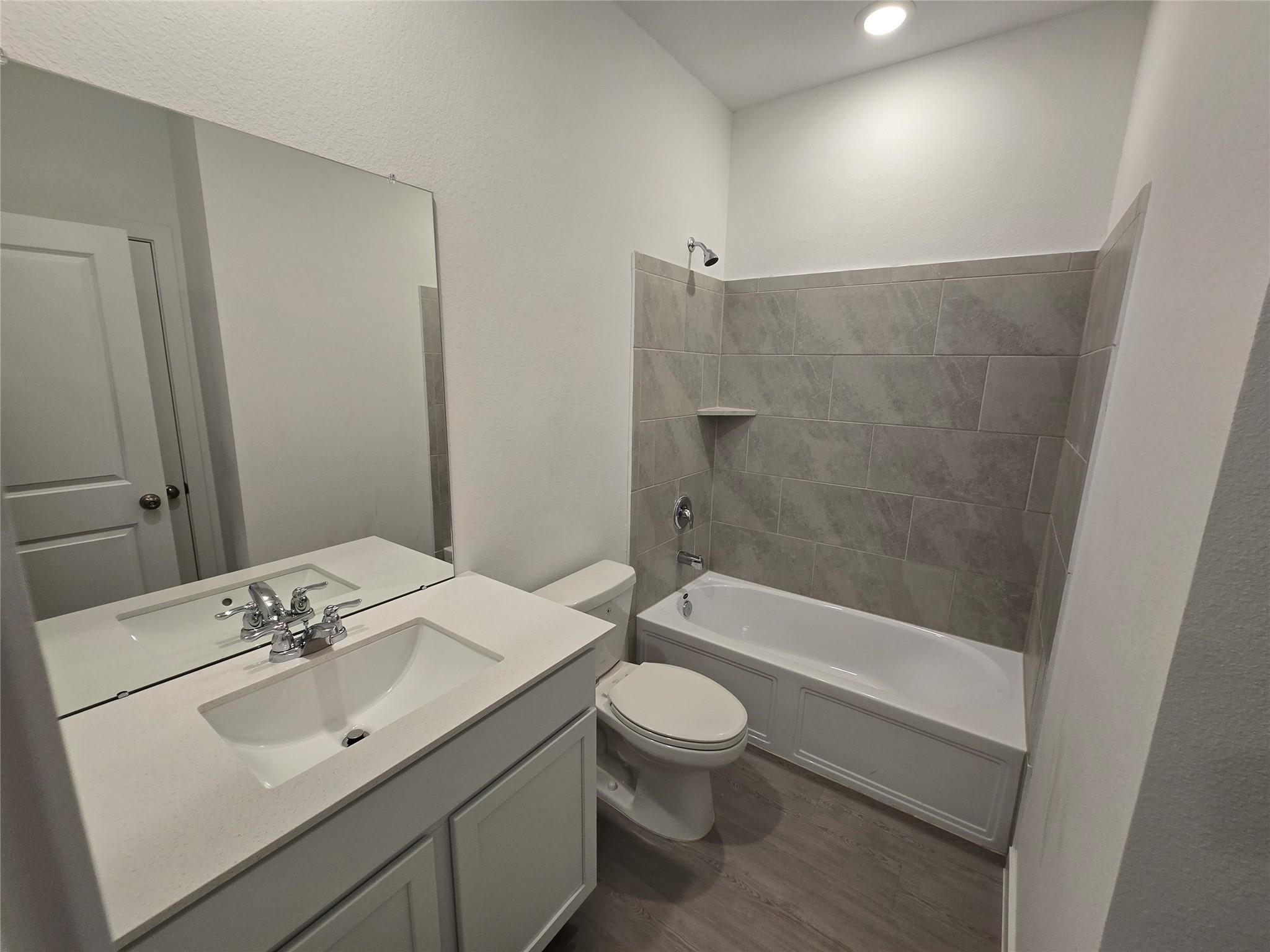 7743 Evening Emerald Drive Rosharon, TX 77583 - Photo 18 of 25 a bathroom with a sink a toilet and shower
