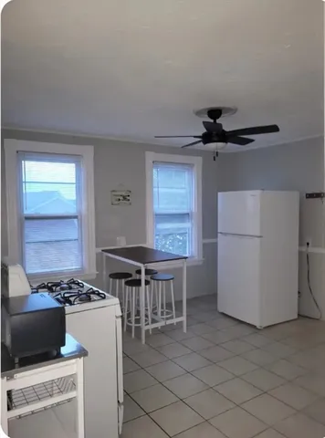 a kitchen with a stove and a refrigerator