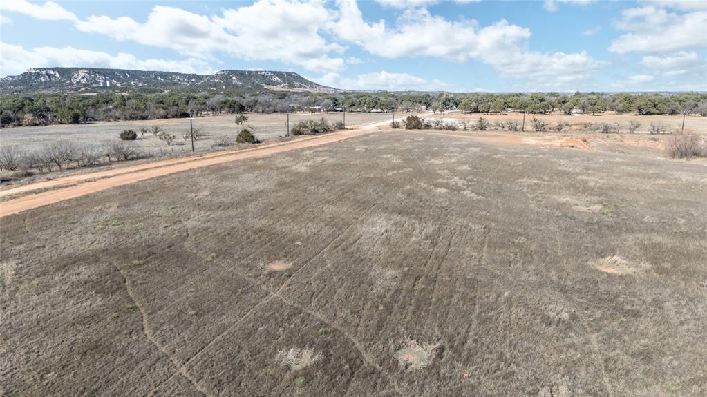 402 Houston Street Buffalo Gap, TX 79508 - Photo 12 of 30 a view of a dry yard and mountain