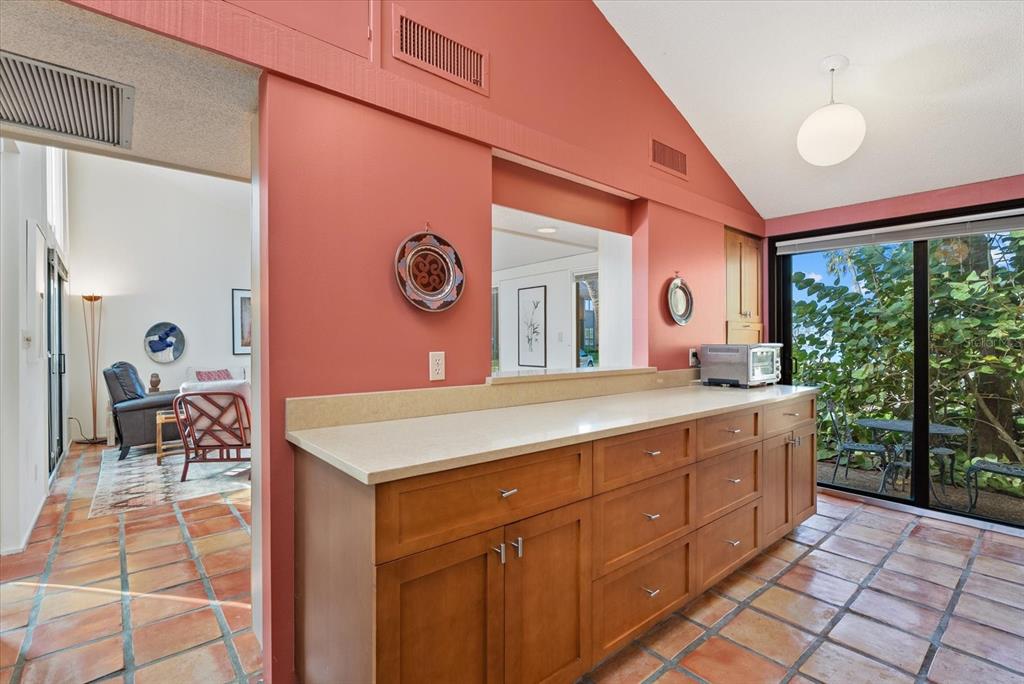 35 Sandy Cove Road, Unit 2A Sarasota, FL 34242 - Photo 14 of 49 a spacious bathroom with a granite countertop sink and a mirror