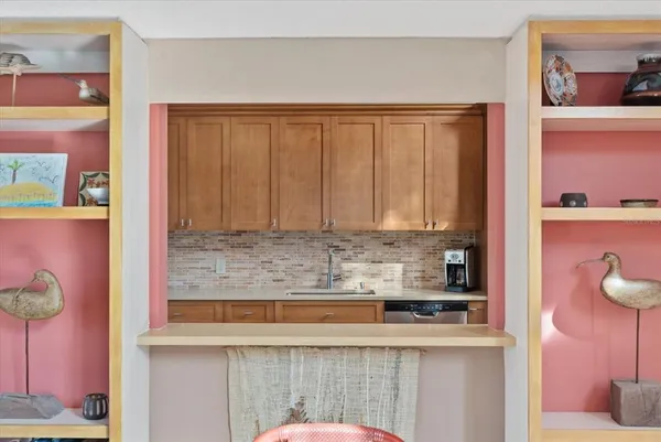 a kitchen with a sink and cabinets