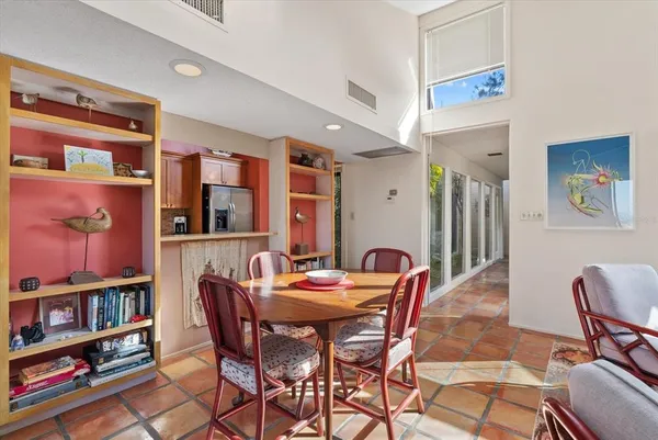 a dining room with a table and chairs