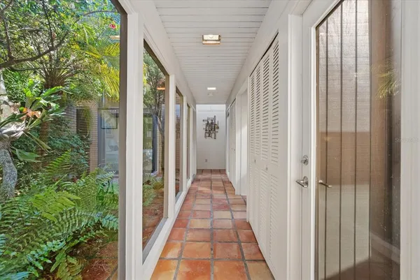 a view of a hallway with balcony