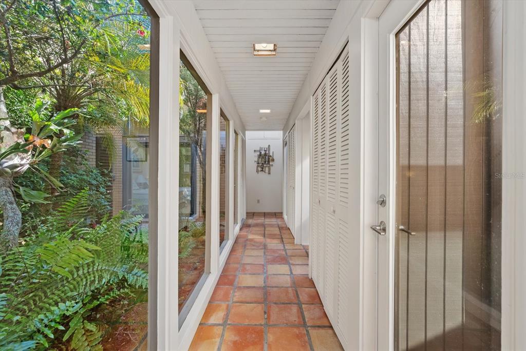 35 Sandy Cove Road, Unit 2A Sarasota, FL 34242 - Photo 20 of 49 a view of a hallway with balcony