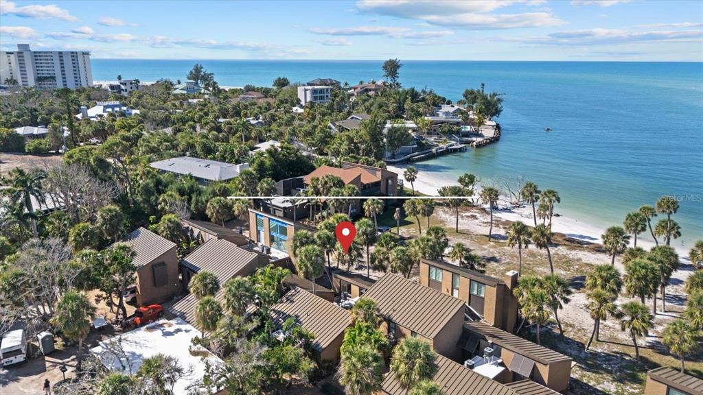 35 Sandy Cove Road, Unit 2A Sarasota, FL 34242 - Photo 2 of 49 a view of a terrace with sitting area