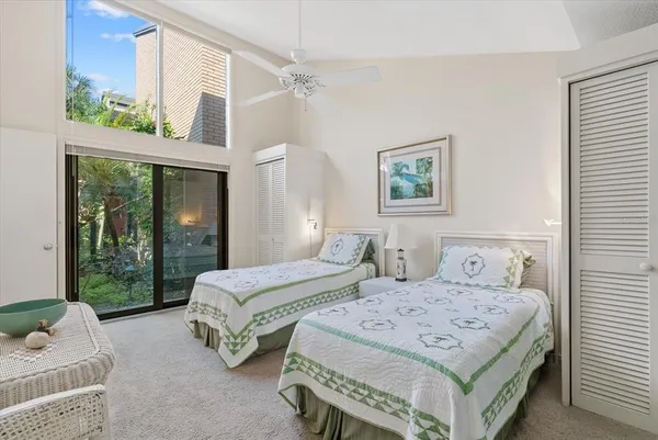 a bedroom with double bed and a window