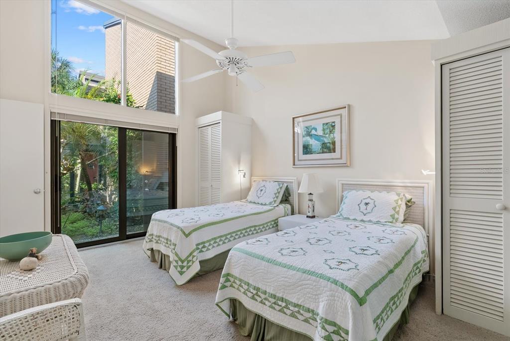 35 Sandy Cove Road, Unit 2A Sarasota, FL 34242 - Photo 26 of 49 a bedroom with double bed and a window