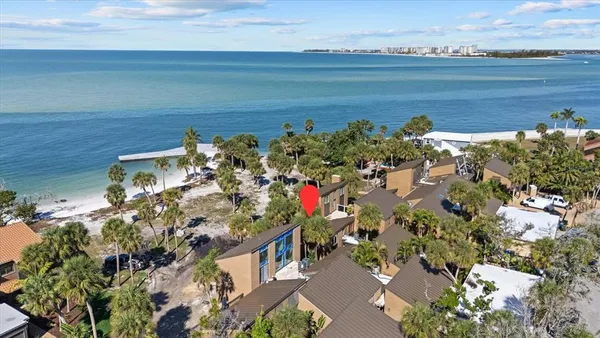 an aerial view of a house with a lake view