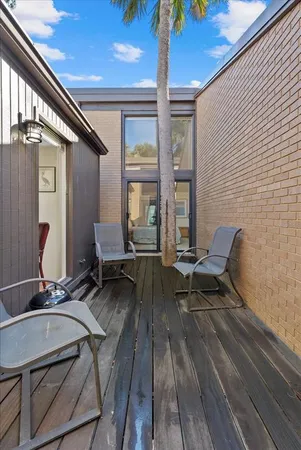a reading room with furniture and wooden floor
