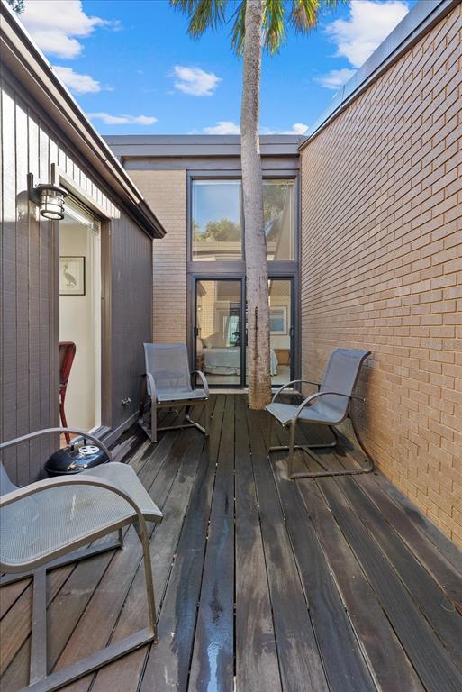 35 Sandy Cove Road, Unit 2A Sarasota, FL 34242 - Photo 32 of 49 a reading room with furniture and wooden floor