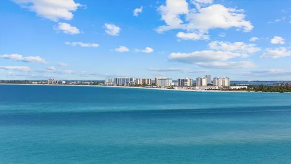 an aerial view of a house with lots of trees