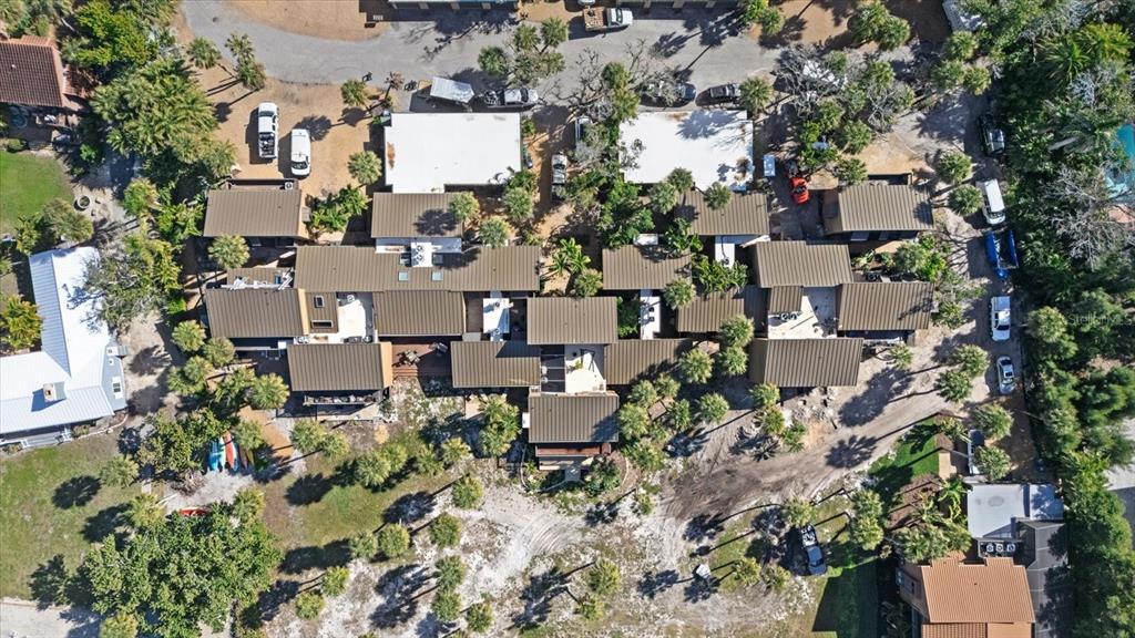 35 Sandy Cove Road, Unit 2A Sarasota, FL 34242 - Photo 48 of 49 an aerial view of a house with lots of trees