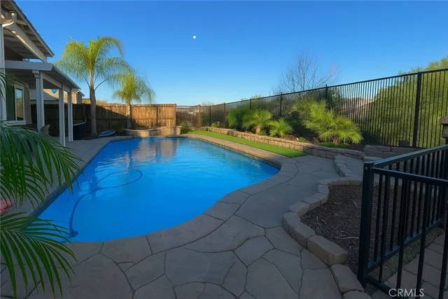 a view of a swimming pool with a patio
