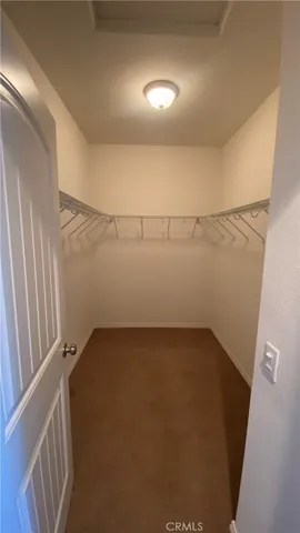 a white toilet sitting next to a sink