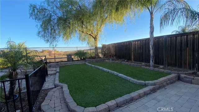 a view of a backyard of the house
