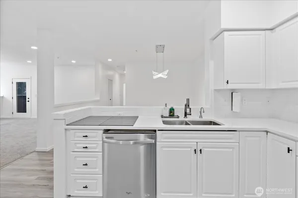 a kitchen with a sink vanity and cabinets
