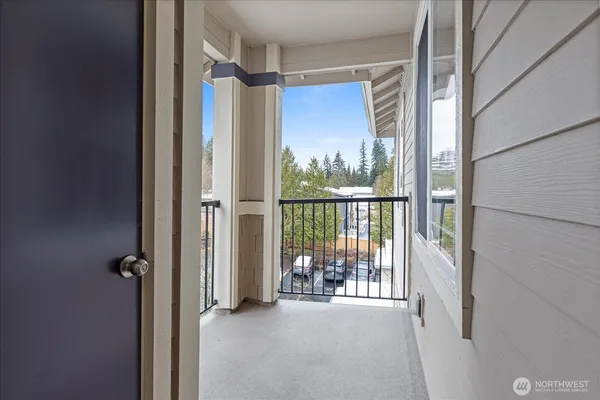 a view of a glass door and the balcony