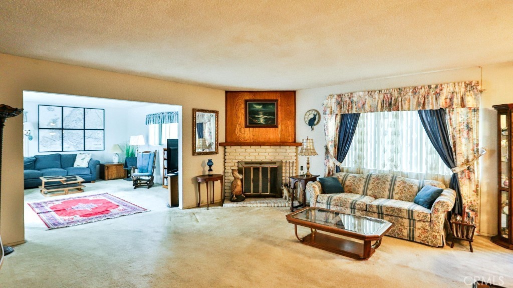 428 West 8th Street Upland, CA 91786 - Photo 11 of 50 a living room with furniture and a fireplace