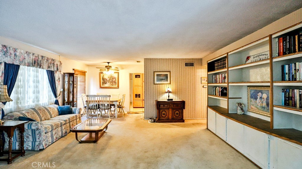 428 West 8th Street Upland, CA 91786 - Photo 13 of 50 a living room with furniture and a book shelf