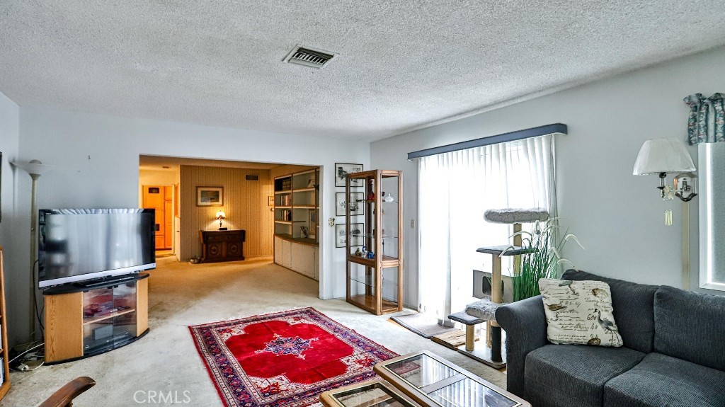 428 West 8th Street Upland, CA 91786 - Photo 17 of 50 a living room with furniture and a window
