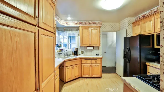 a spacious bathroom with a granite countertop sink and a mirror