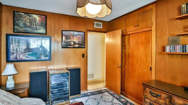 a view of a hallway with paintings on the wall