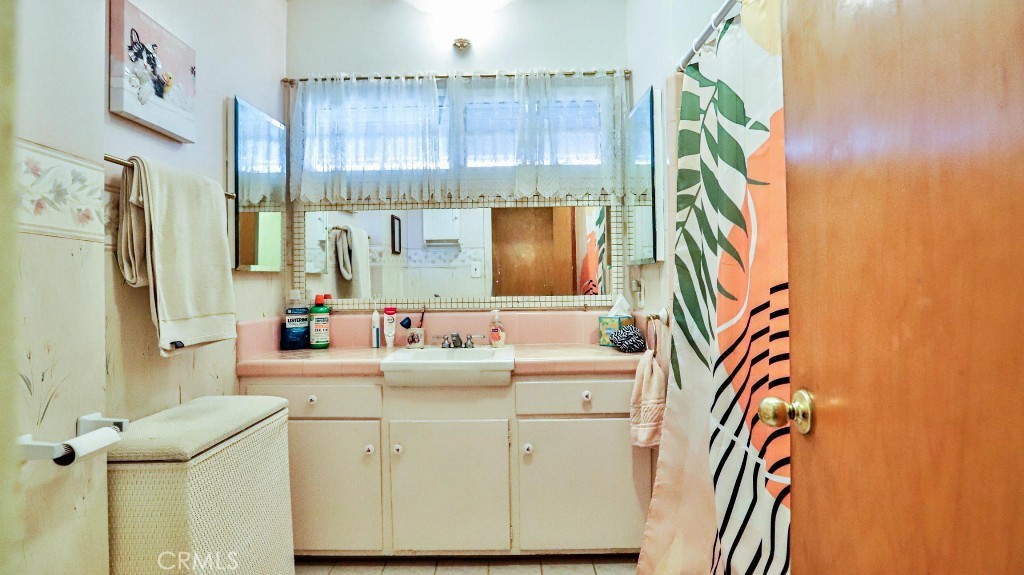 428 West 8th Street Upland, CA 91786 - Photo 32 of 50 a bathroom with a sink and a mirror