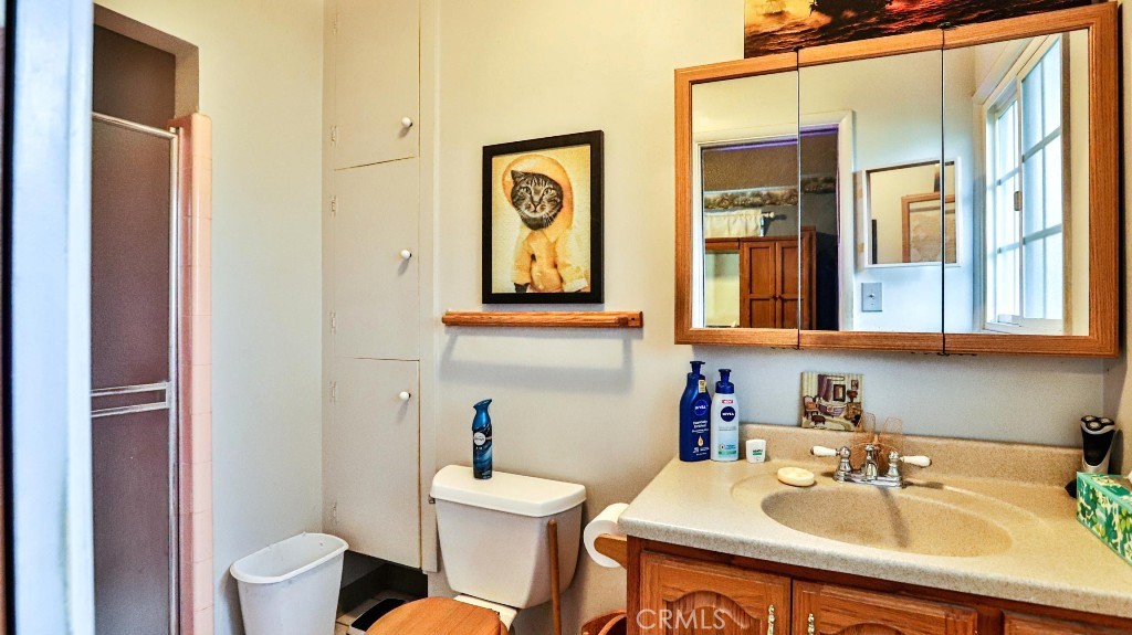 428 West 8th Street Upland, CA 91786 - Photo 37 of 50 a bathroom with a sink toilet and mirror