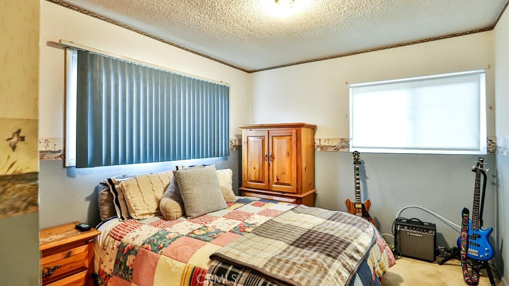 428 West 8th Street Upland, CA 91786 - Photo 38 of 50 a bedroom with a bed and a window