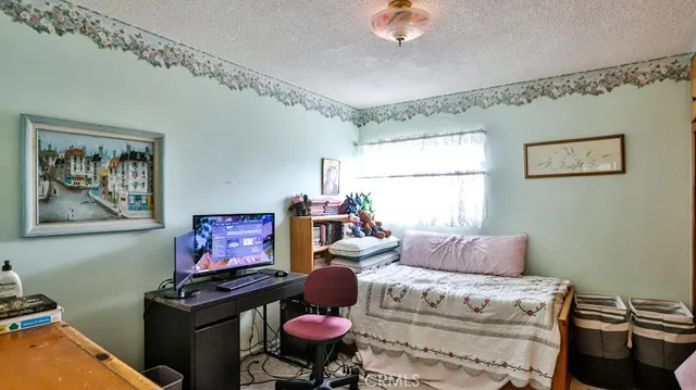 a bedroom with furniture and a bed