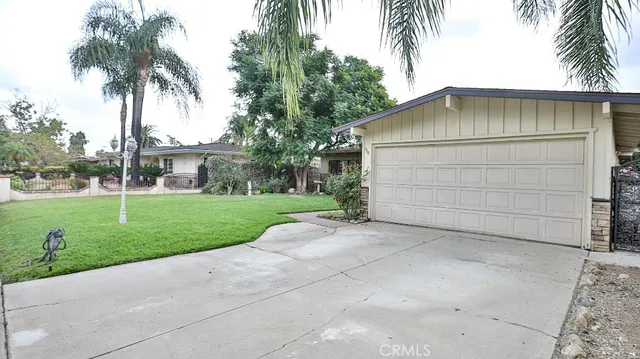 front view of house with palm trees