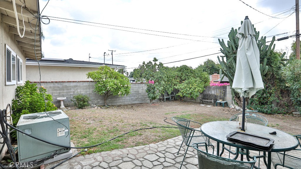 428 West 8th Street Upland, CA 91786 - Photo 43 of 50 a backyard of a house with table and chairs