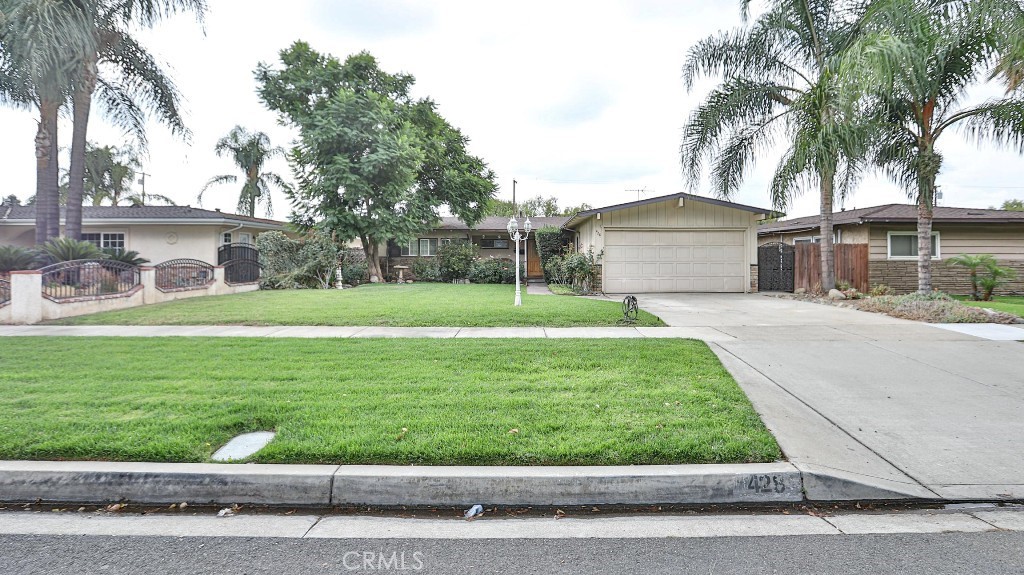 428 West 8th Street Upland, CA 91786 - Photo 6 of 50 a front view of house with yard and green space