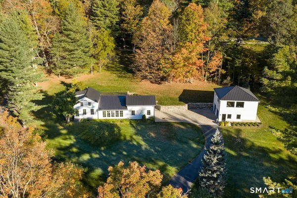 a aerial view of a house with a yard