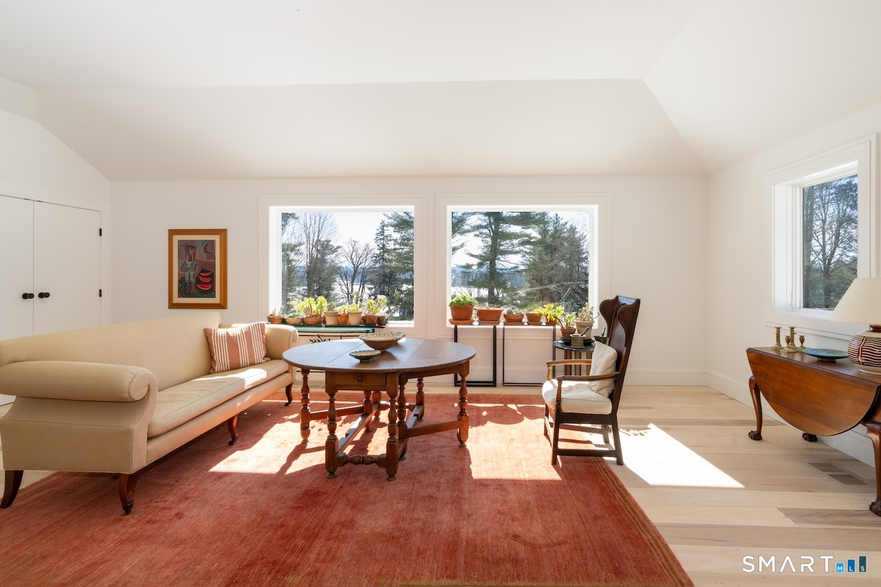 31 Belgo Road Salisbury, CT 06039 - Photo 19 of 25 a living room with furniture dining table and a large window