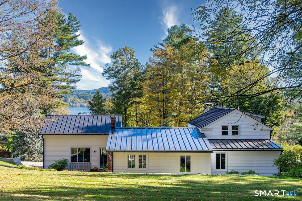 31 Belgo Road Salisbury, CT 06039 - Photo 2 of 25 a view of a house with a swimming pool and wooden deck