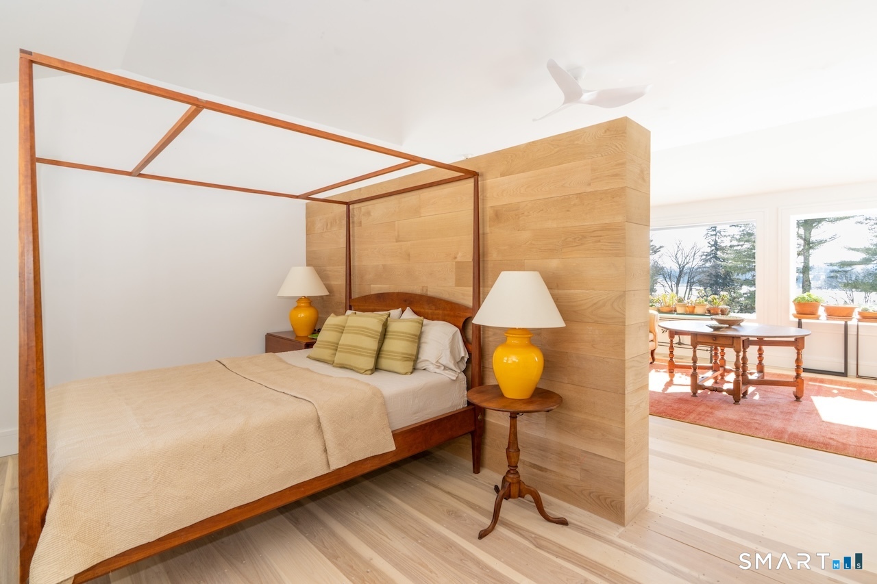 31 Belgo Road Salisbury, CT 06039 - Photo 21 of 25 a bedroom with a bed and a lamp next to a window