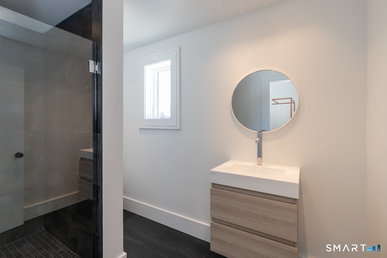 31 Belgo Road Salisbury, CT 06039 - Photo 22 of 25 a bathroom with a sink and a mirror