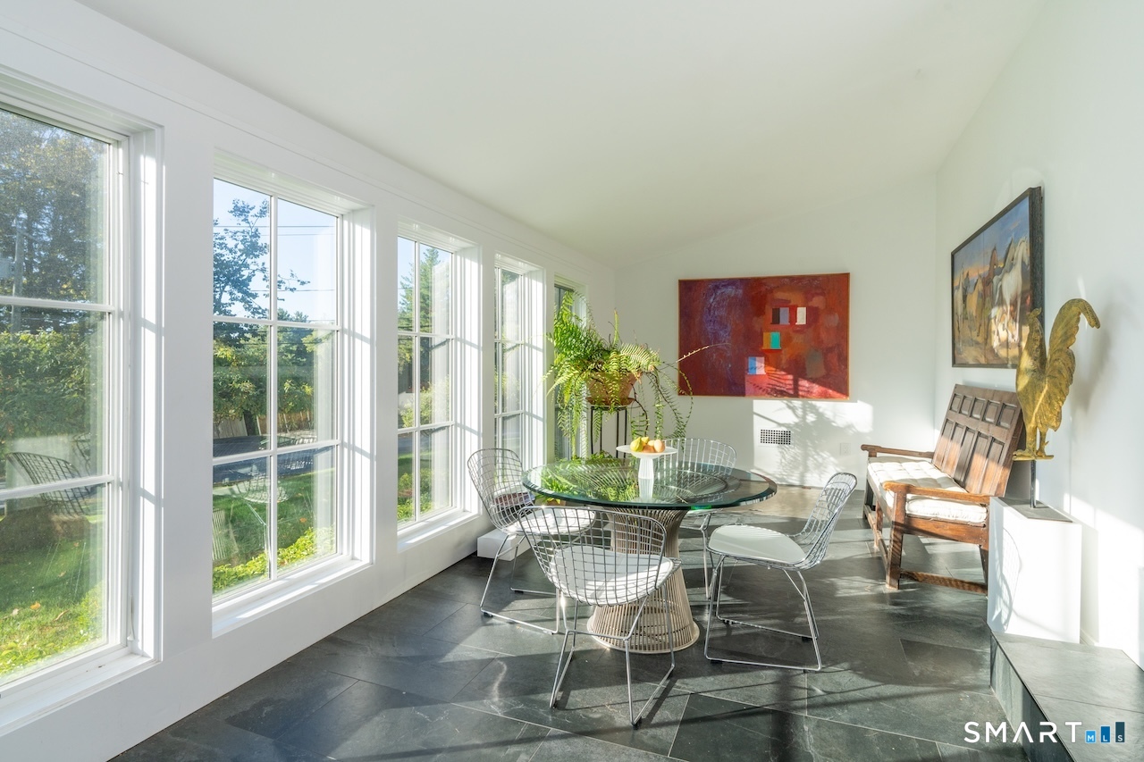 31 Belgo Road Salisbury, CT 06039 - Photo 3 of 25 a dining room with furniture mountain view and wooden floor
