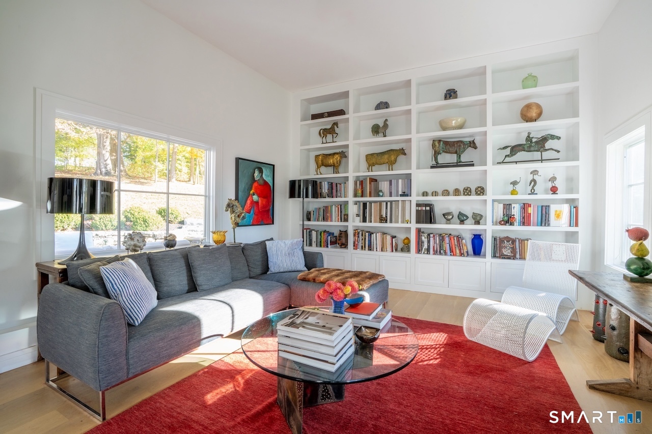 31 Belgo Road Salisbury, CT 06039 - Photo 4 of 25 a living room with furniture and a book shelf