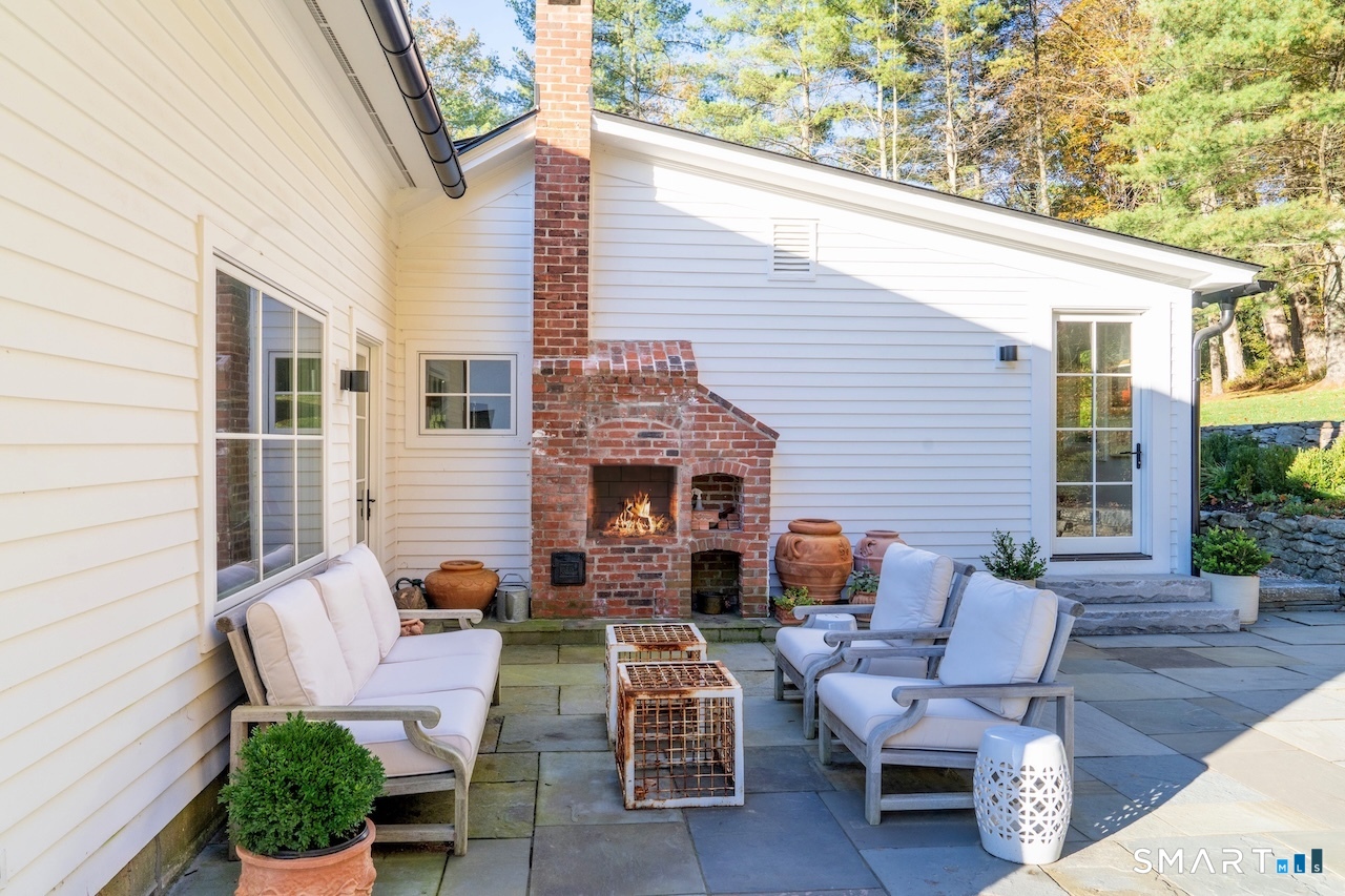 31 Belgo Road Salisbury, CT 06039 - Photo 5 of 25 a view of a patio with couple of chairs and a potted plant
