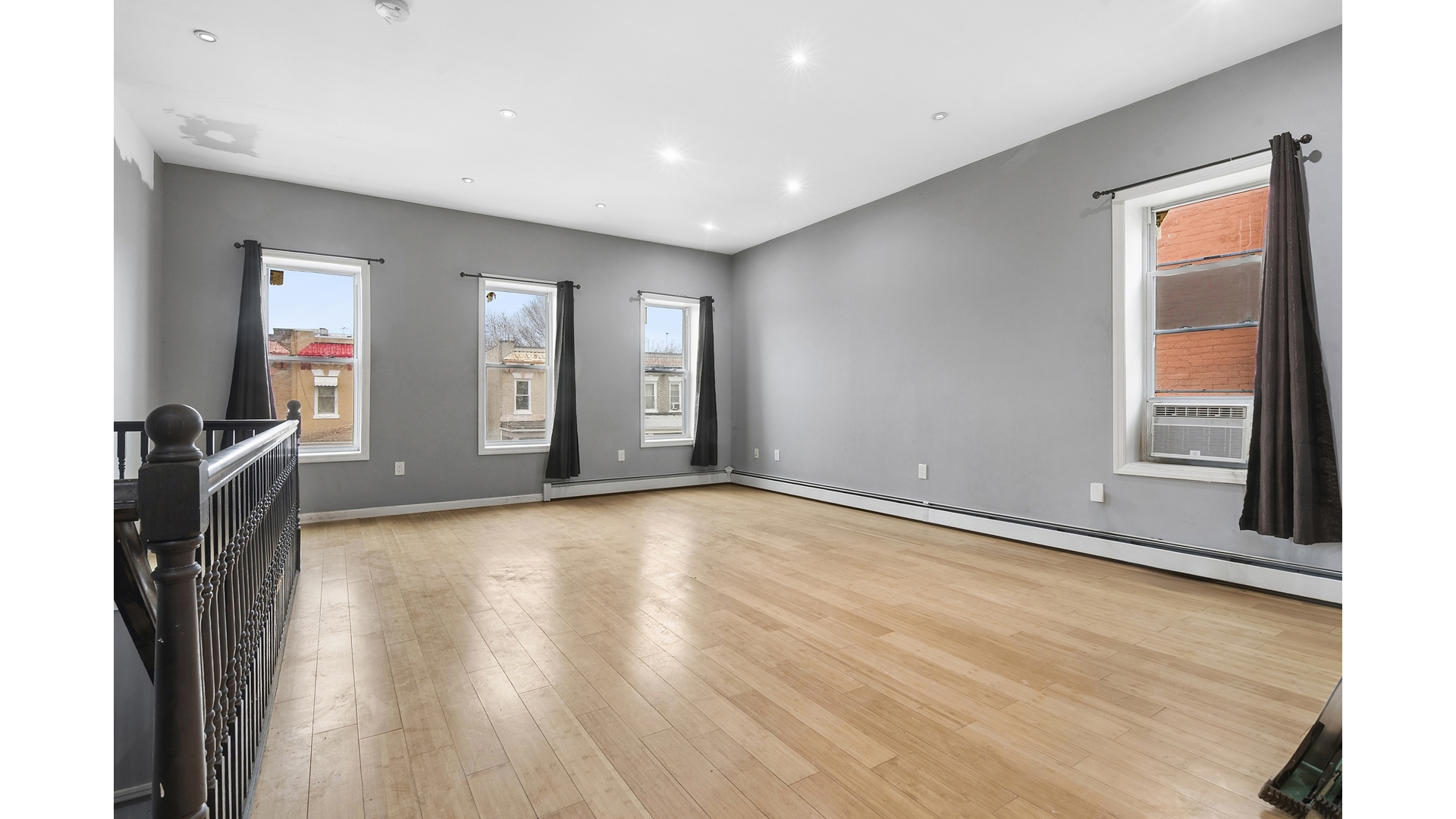 2001 Strauss Street, Unit 2 Brooklyn, NY 11212 - Photo 2 of 6 a view of a livingroom with a hard wood floor